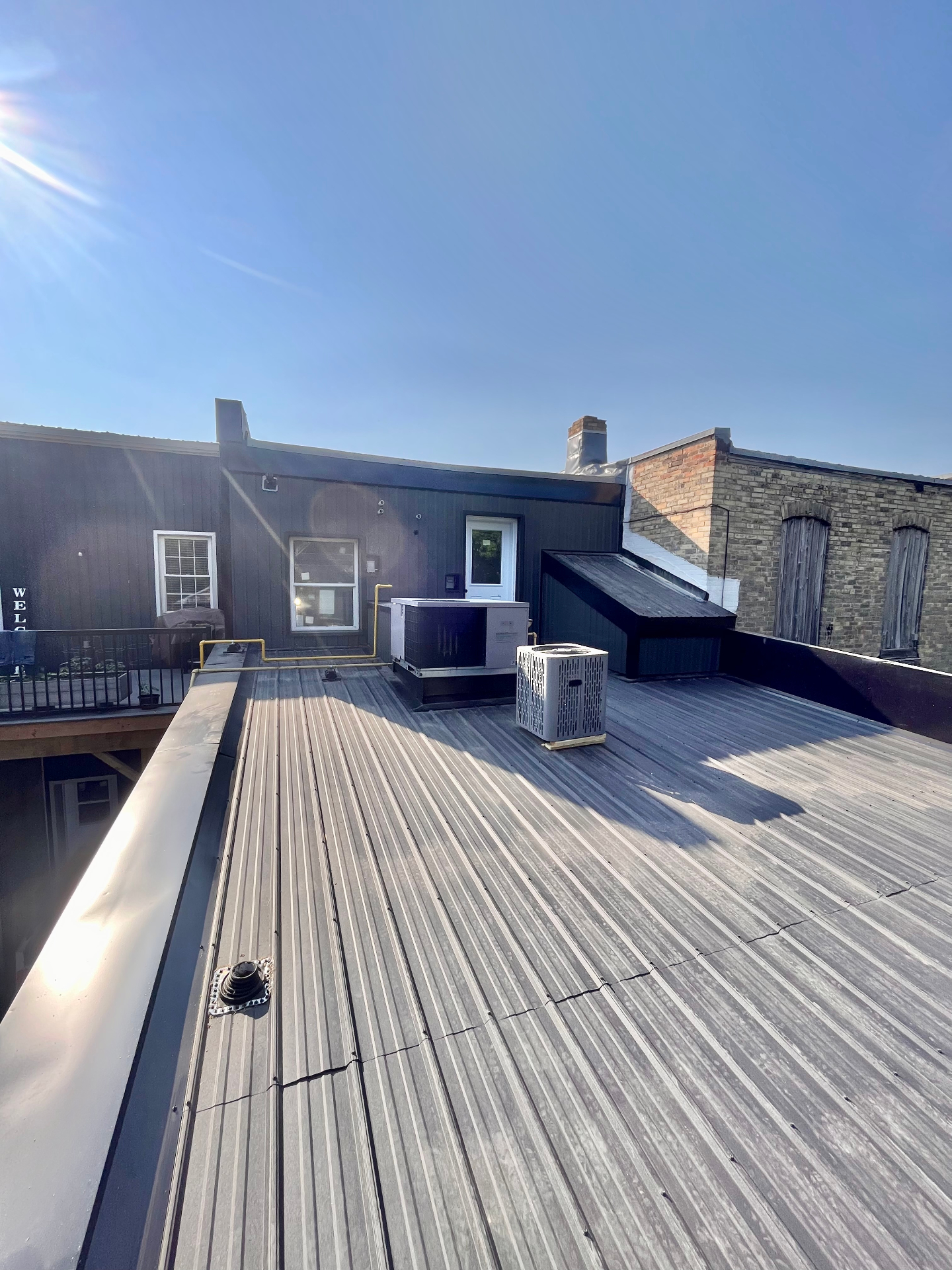 Completed standing seam metal roof on a downtown commercial building in Brussels